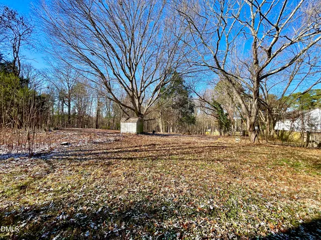 a view of yard covered with snow