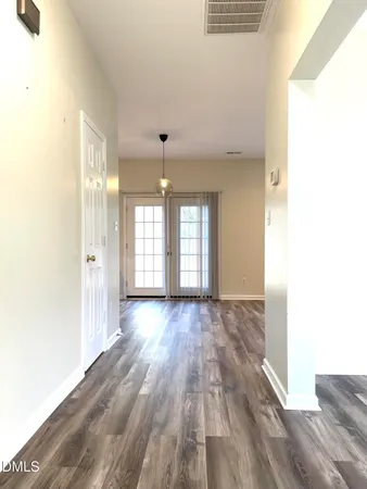 a view of an empty room and window