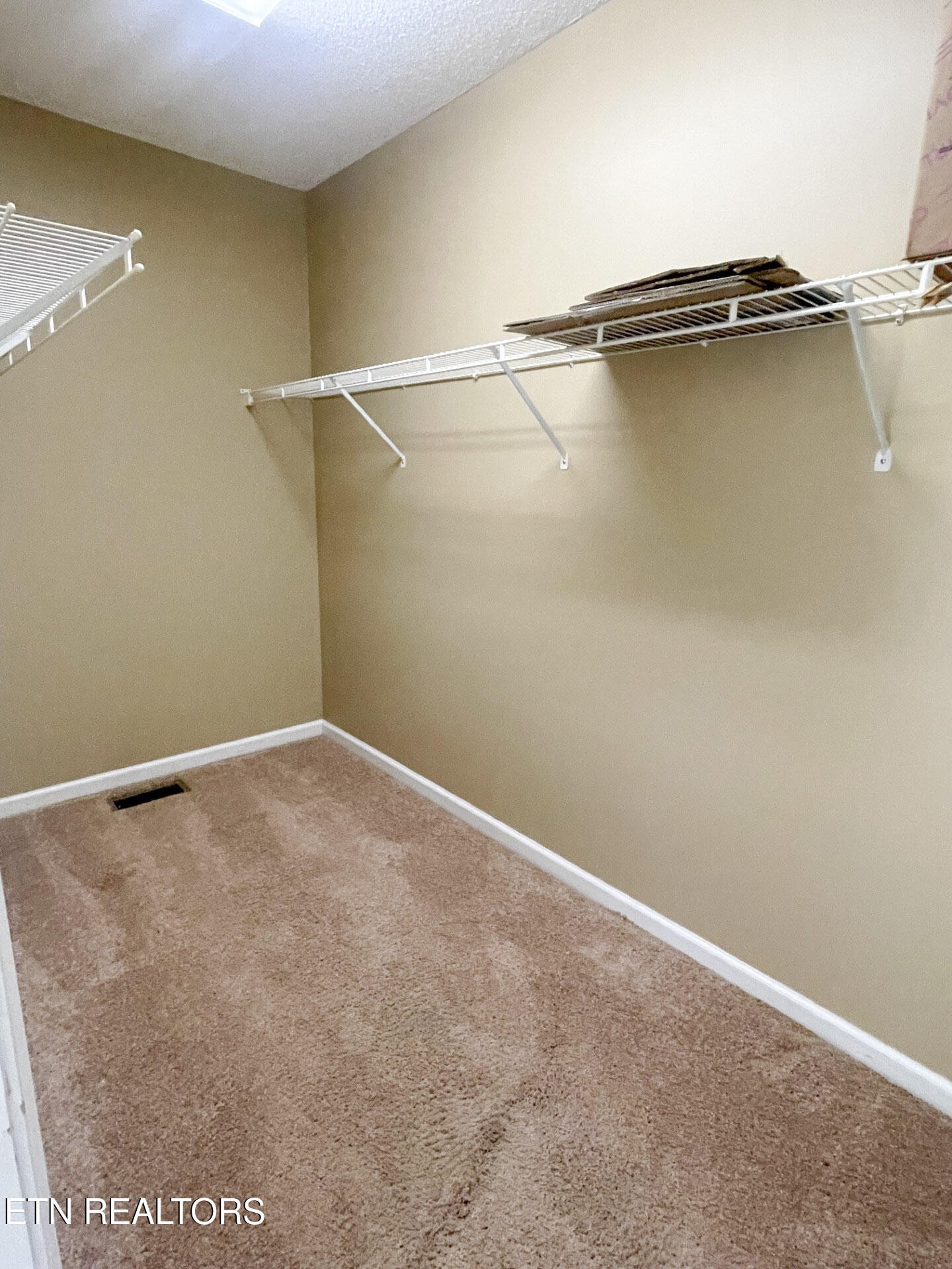 299 Jesse Loop Crossville, TN 38555 - Photo 13 of 32 an empty room with a wooden floor and a window
