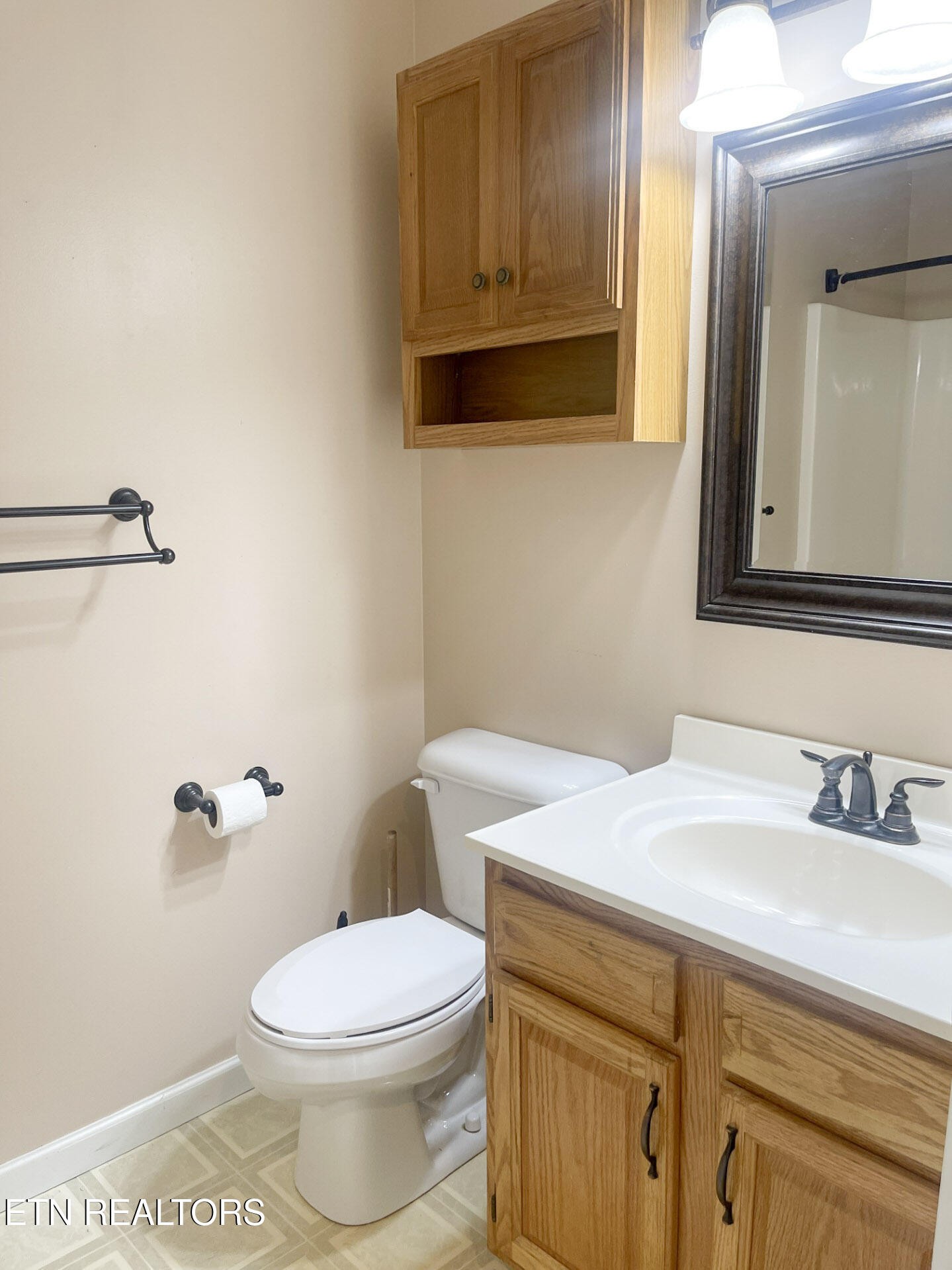 299 Jesse Loop Crossville, TN 38555 - Photo 18 of 32 a bathroom with a sink a toilet and mirror