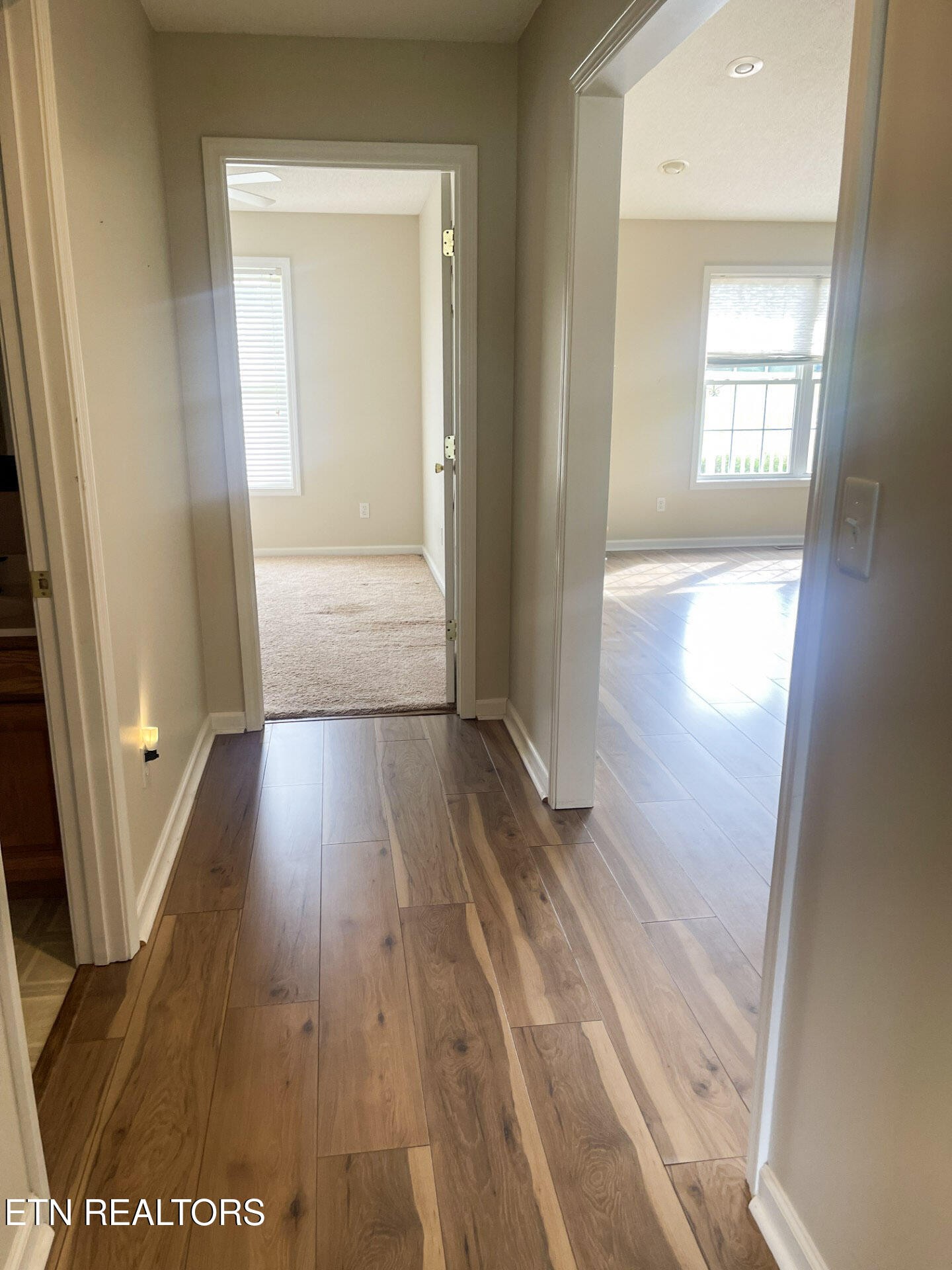 299 Jesse Loop Crossville, TN 38555 - Photo 22 of 32 a view of a hallway with wooden floor and a living room