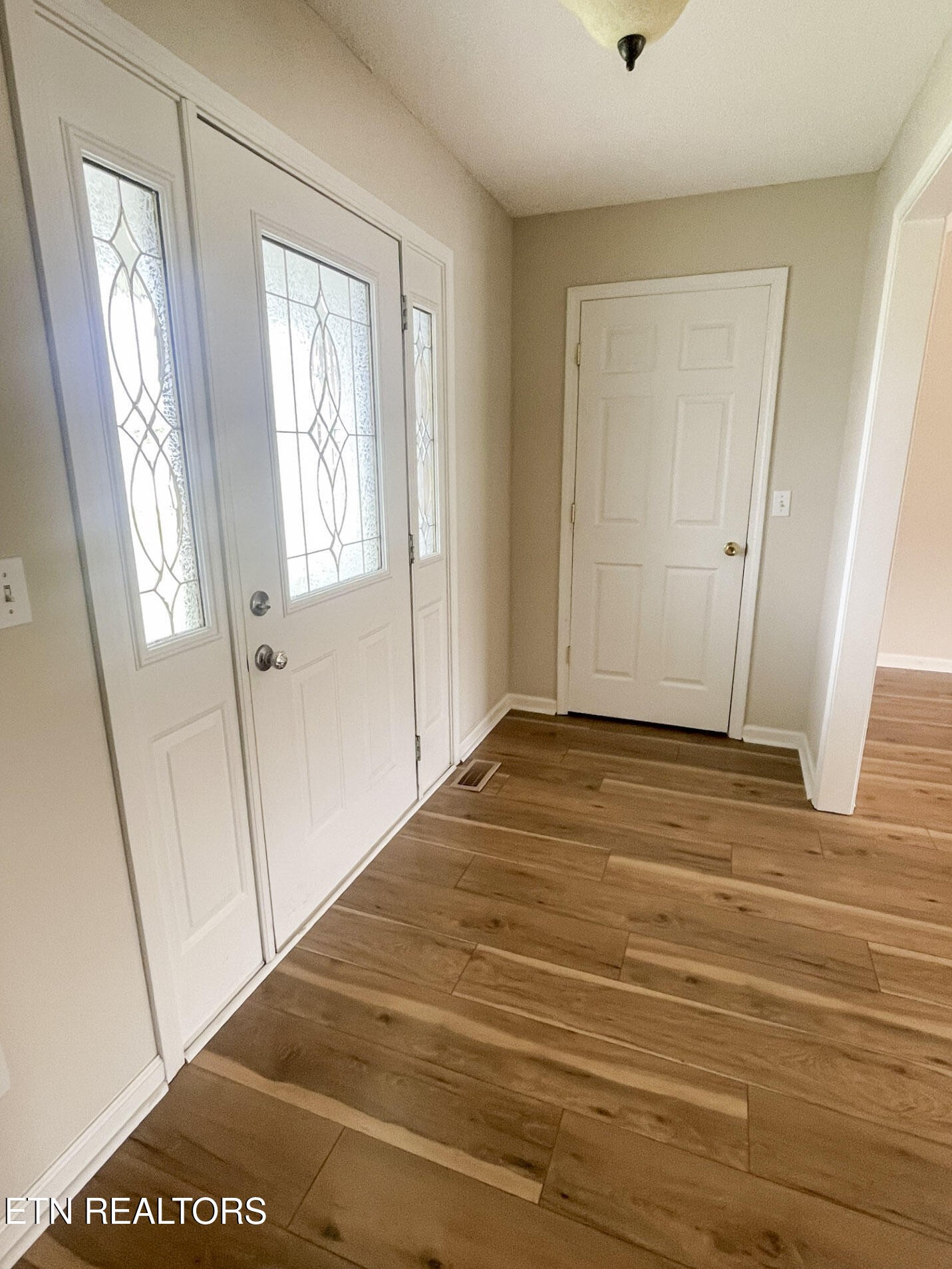 299 Jesse Loop Crossville, TN 38555 - Photo 23 of 32 a view of an empty room with wooden floor