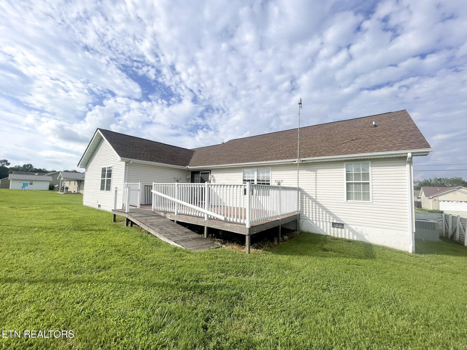 299 Jesse Loop Crossville, TN 38555 - Photo 29 of 32 a backyard of a house with table and chairs