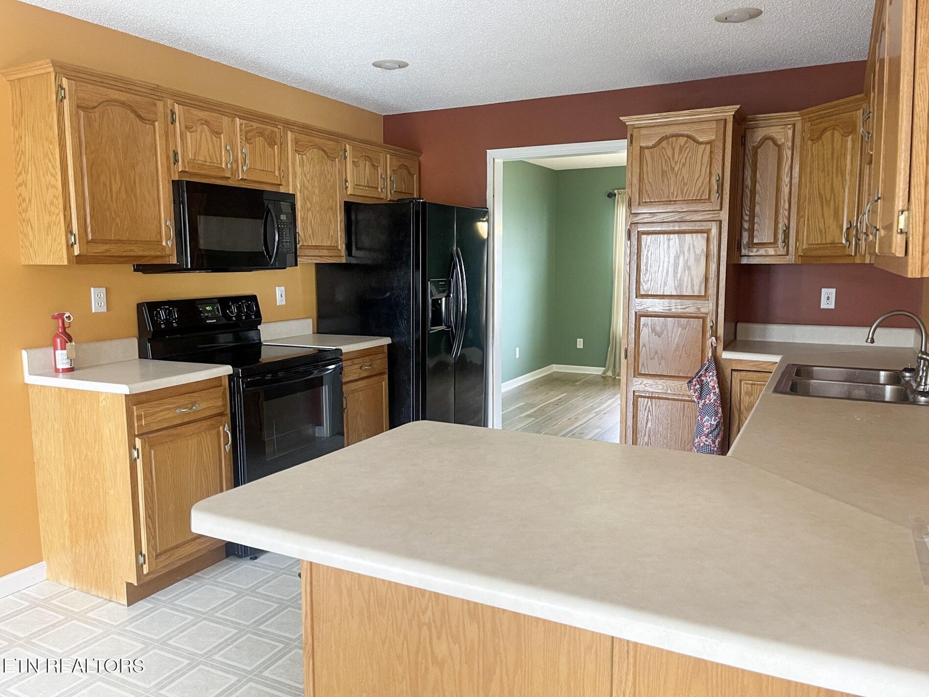 299 Jesse Loop Crossville, TN 38555 - Photo 8 of 32 a kitchen with stainless steel appliances a refrigerator stove microwave and sink