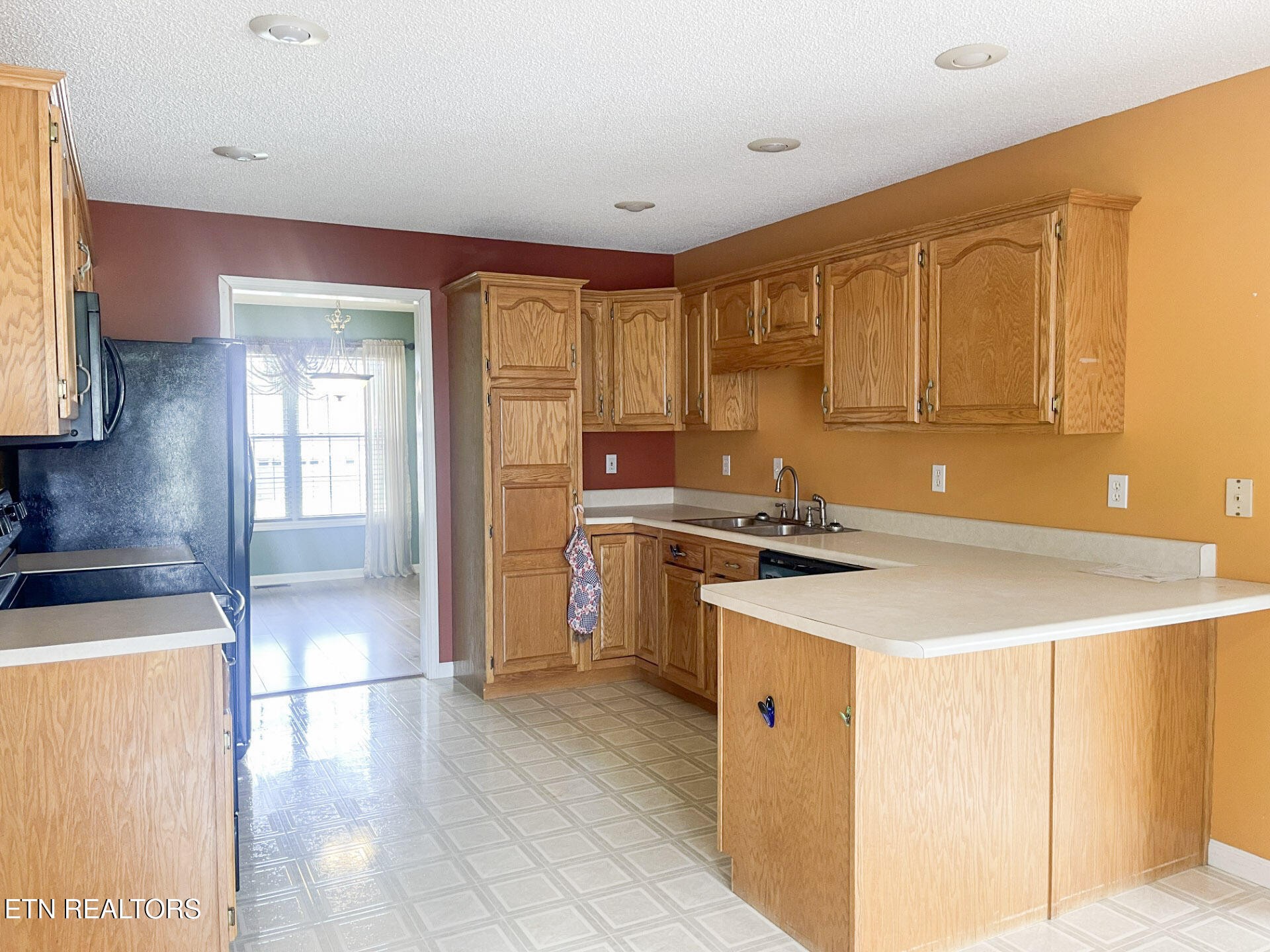 299 Jesse Loop Crossville, TN 38555 - Photo 9 of 32 a kitchen with stainless steel appliances granite countertop a sink a stove and a refrigerator