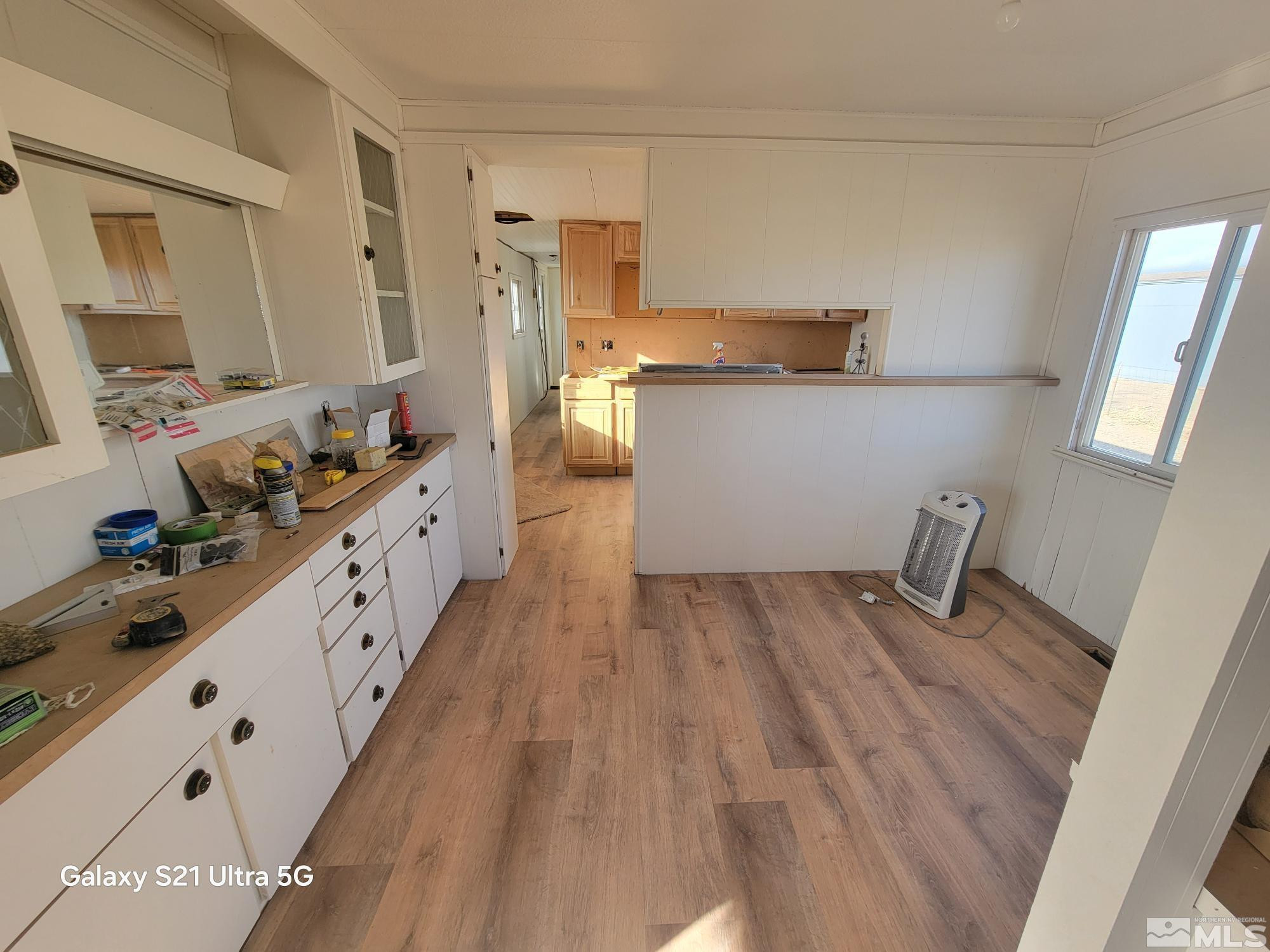 3205 Citrus Street Silver Springs, NV 89429 - Photo 3 of 15 a kitchen with sink wooden floor and stove