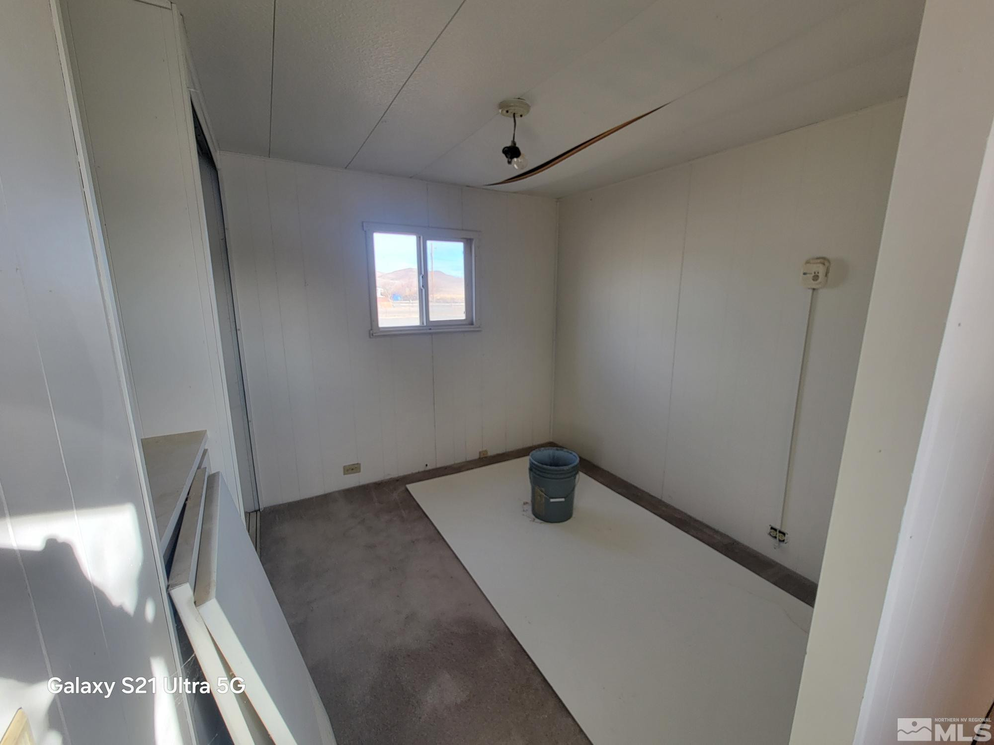 3205 Citrus Street Silver Springs, NV 89429 - Photo 4 of 15 a view of an empty room with a window