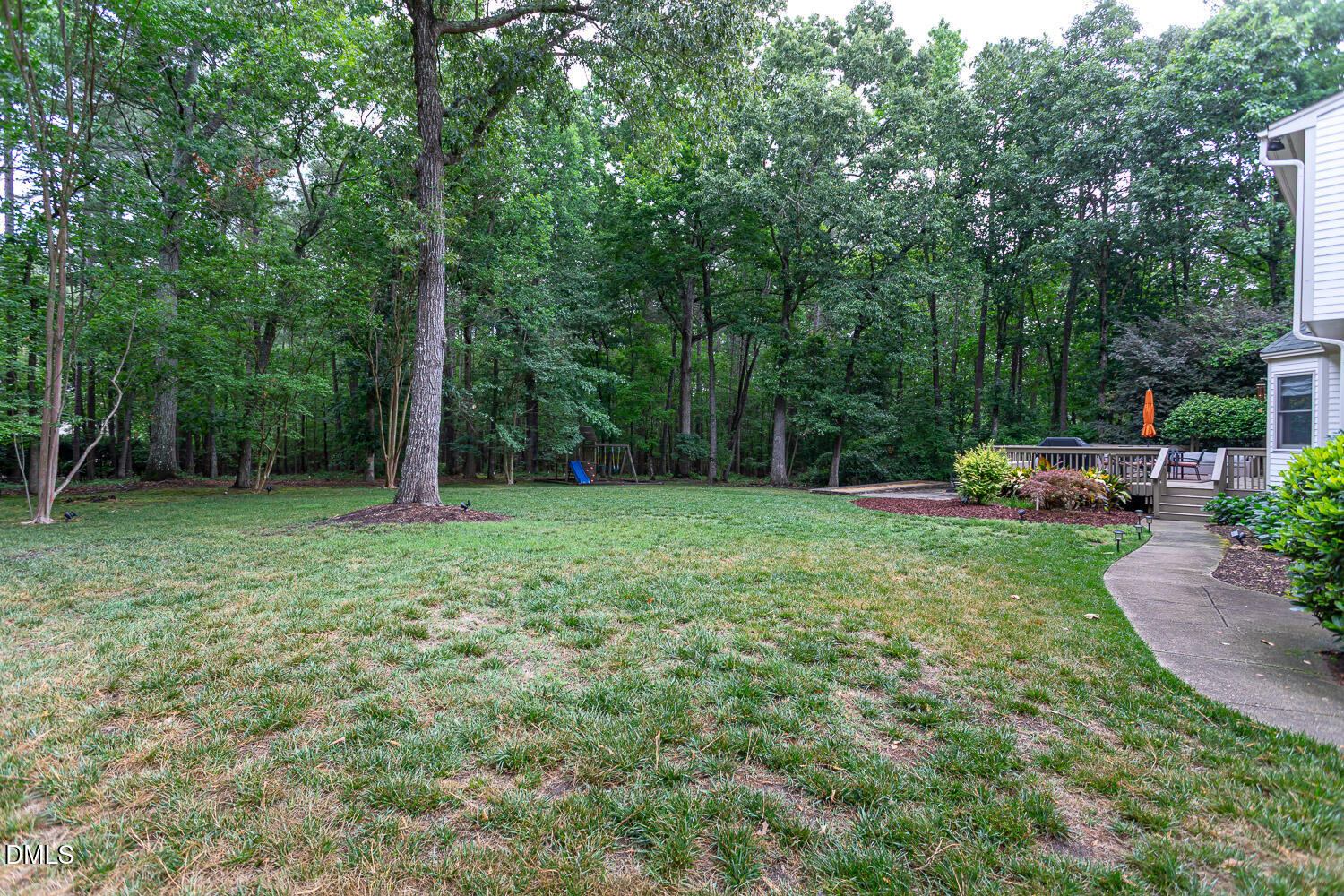 8509 Towneley Place Raleigh, NC 27615 - Photo 32 of 36 a garden view with a seating space