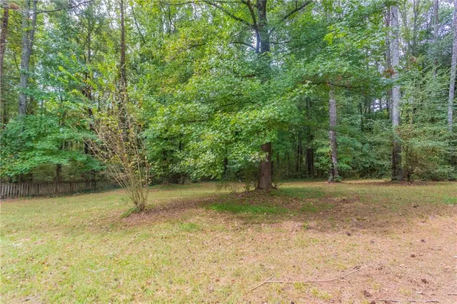 a backyard of a house with a trees