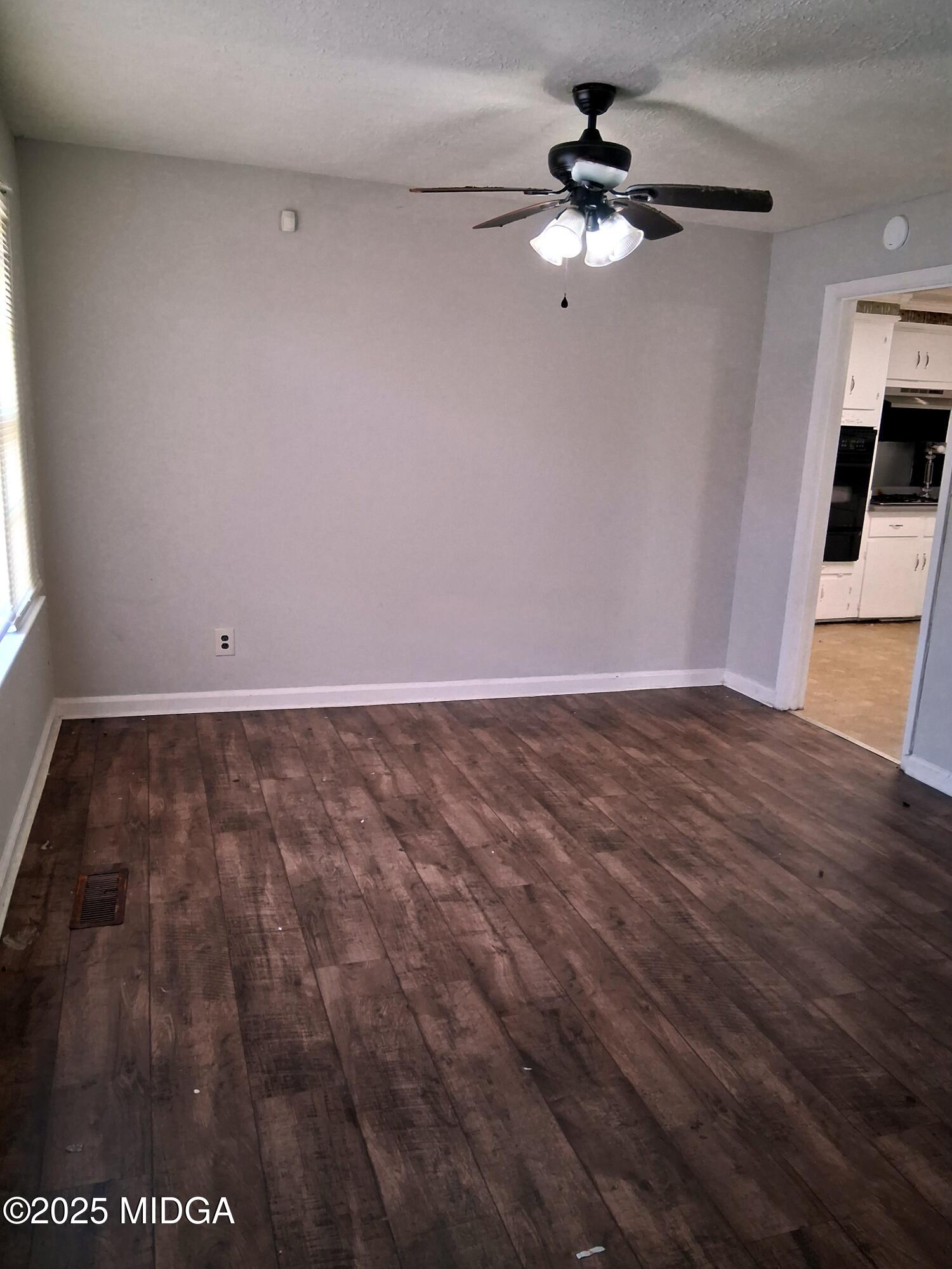 1464 Williamson Road Macon, GA 31206 - Photo 4 of 9 a view of empty room with ceiling fan
