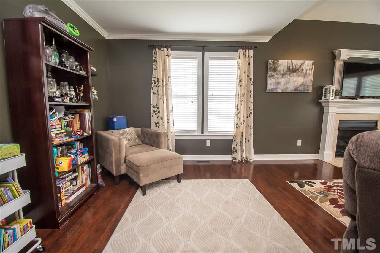 4813 Kure Road Raleigh, NC 27603 - Photo 9 of 25 a bedroom with furniture and a book shelf