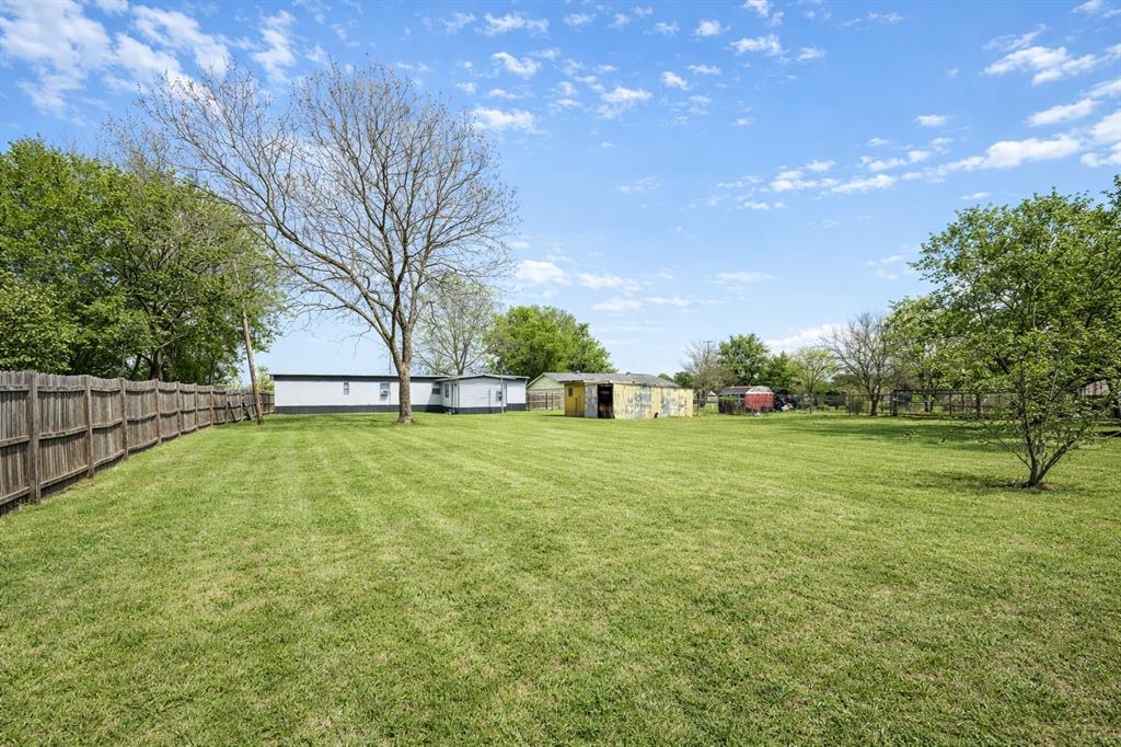202 Austin Street Rice, TX 75155 - Photo 2 of 2 a view of outdoor space with deck and yard