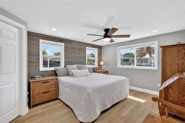 a bedroom with a large bed and a window