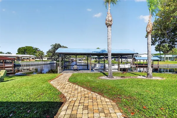 a view of a swimming pool with outdoor seating