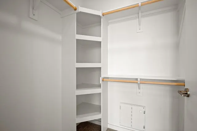 a view of an empty walk in closet