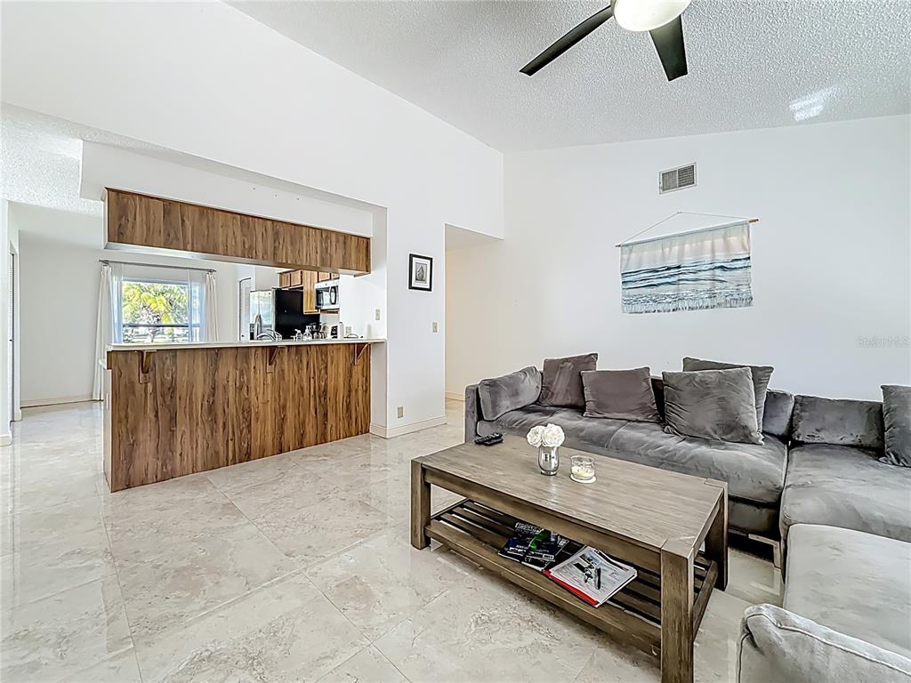 1909 Castle Bay Court Oldsmar, FL 34677 - Photo 16 of 48 a living room with furniture and wooden floor