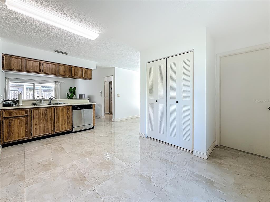 1909 Castle Bay Court Oldsmar, FL 34677 - Photo 22 of 48 a view of kitchen with stainless steel appliances granite countertop a refrigerator and a sink