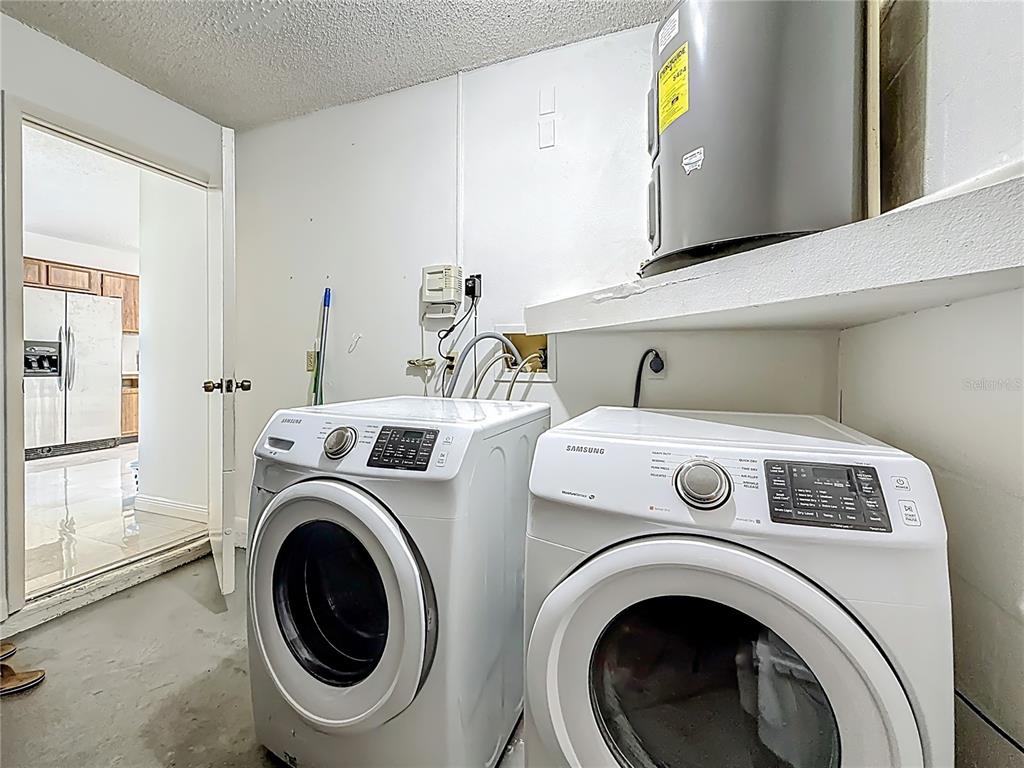 1909 Castle Bay Court Oldsmar, FL 34677 - Photo 35 of 48 a utility room with dryer and washer