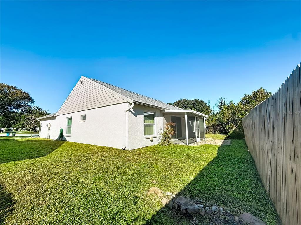 1909 Castle Bay Court Oldsmar, FL 34677 - Photo 37 of 48 a front view of a house with yard