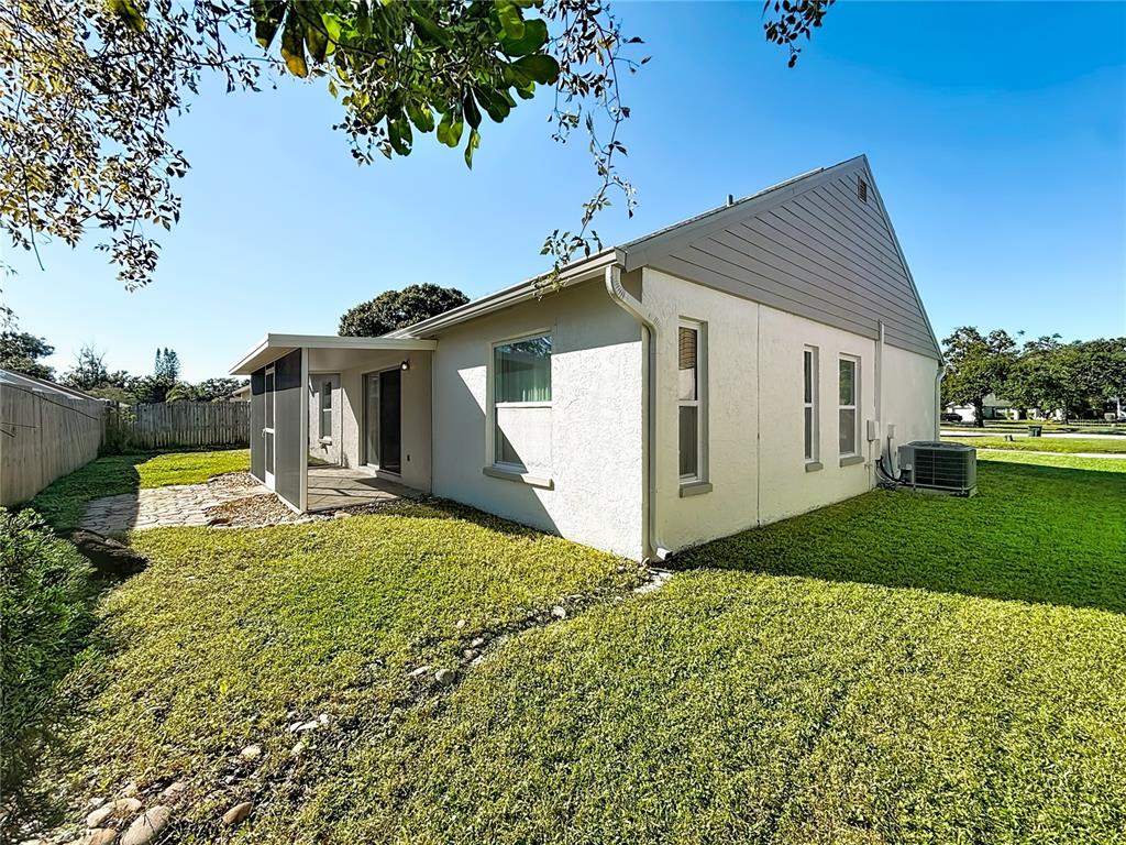 1909 Castle Bay Court Oldsmar, FL 34677 - Photo 38 of 48 a view of a house with a yard