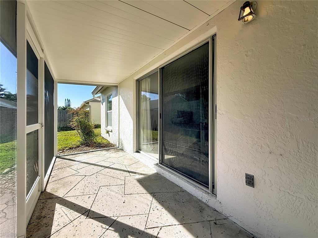 1909 Castle Bay Court Oldsmar, FL 34677 - Photo 42 of 48 a view of a hallway with wooden floor and a bathroom