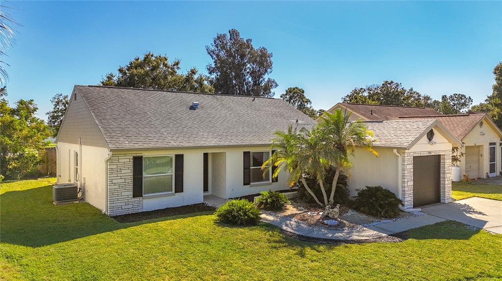 1909 Castle Bay Court Oldsmar, FL 34677 - Photo 6 of 48 a view of house with yard entertaining space and a swimming pool