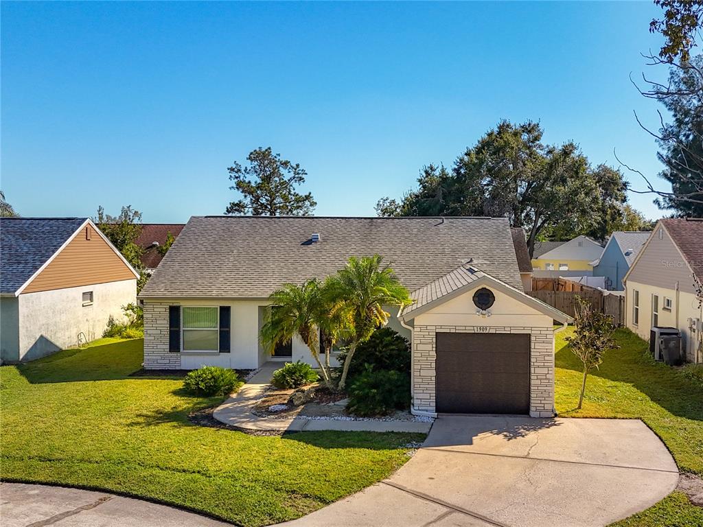 1909 Castle Bay Court Oldsmar, FL 34677 - Photo 7 of 48 a front view of a house with a yard