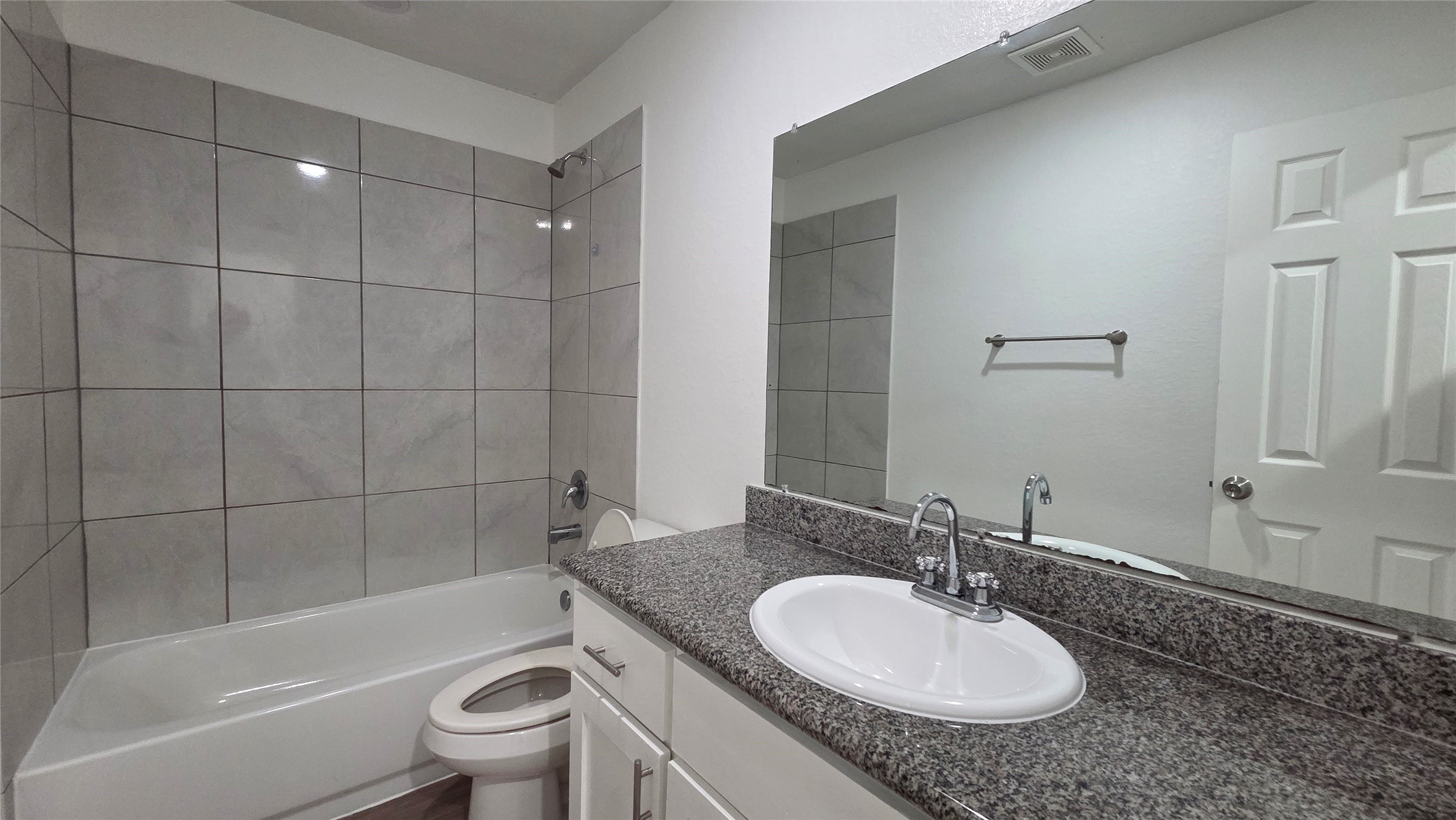 23338 Sandpiper Trail Spring, TX 77373 - Photo 10 of 13 a bathroom with a granite countertop sink toilet and shower