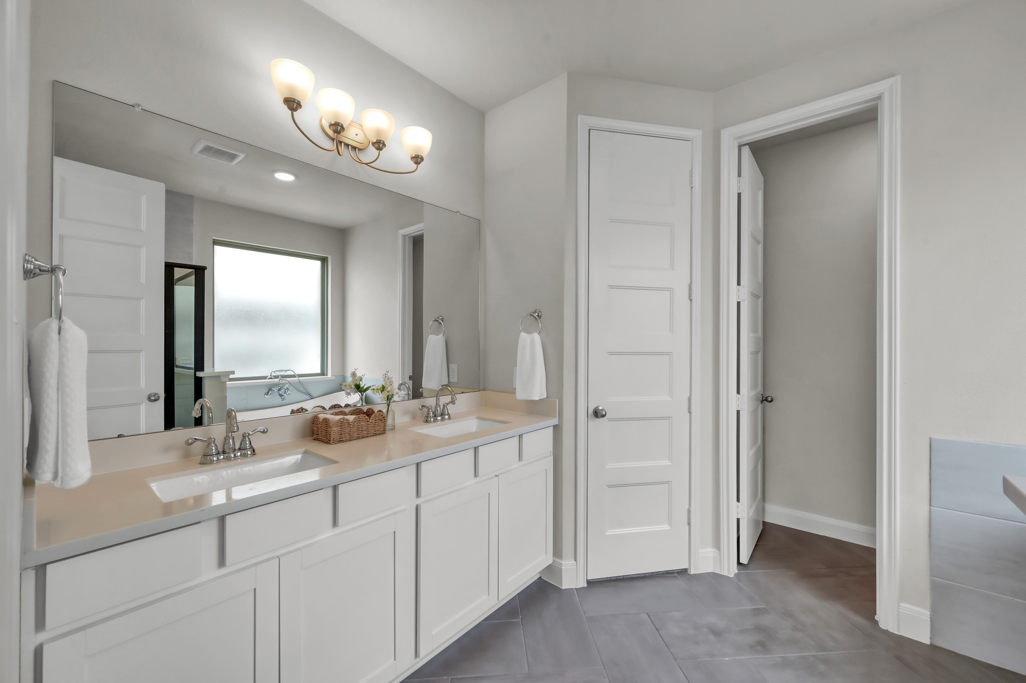 550 Chestnut Reef Court Conroe, TX 77304 - Photo 19 of 46 Primary bath with dual vanities, ample storage, and clean, modern finishes.