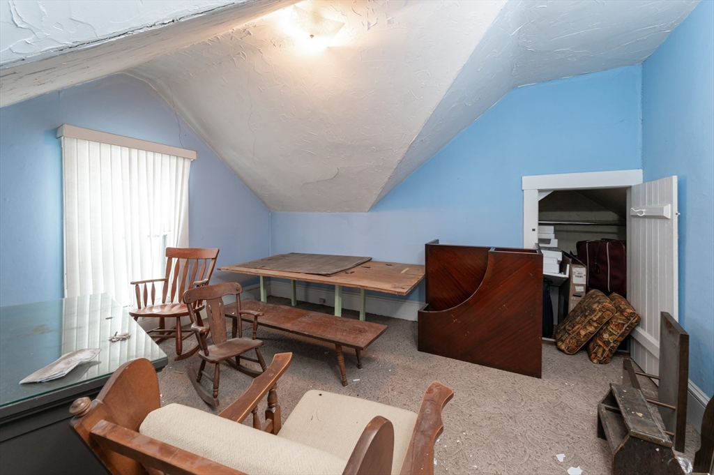 525 Chelmsford Street Lowell, MA 01851 - Photo 18 of 41 a bedroom with furniture and a window