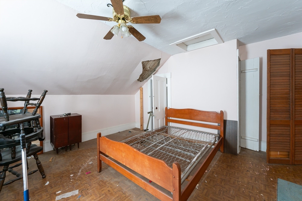 525 Chelmsford Street Lowell, MA 01851 - Photo 20 of 41 a view of room with window and wooden floor
