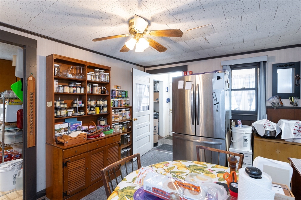 525 Chelmsford Street Lowell, MA 01851 - Photo 6 of 41 a kitchen with stainless steel appliances kitchen island granite countertop a refrigerator and microwave