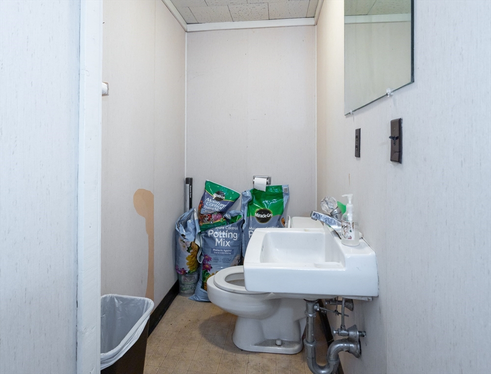 525 Chelmsford Street Lowell, MA 01851 - Photo 9 of 41 a bathroom with a sink and a toilet