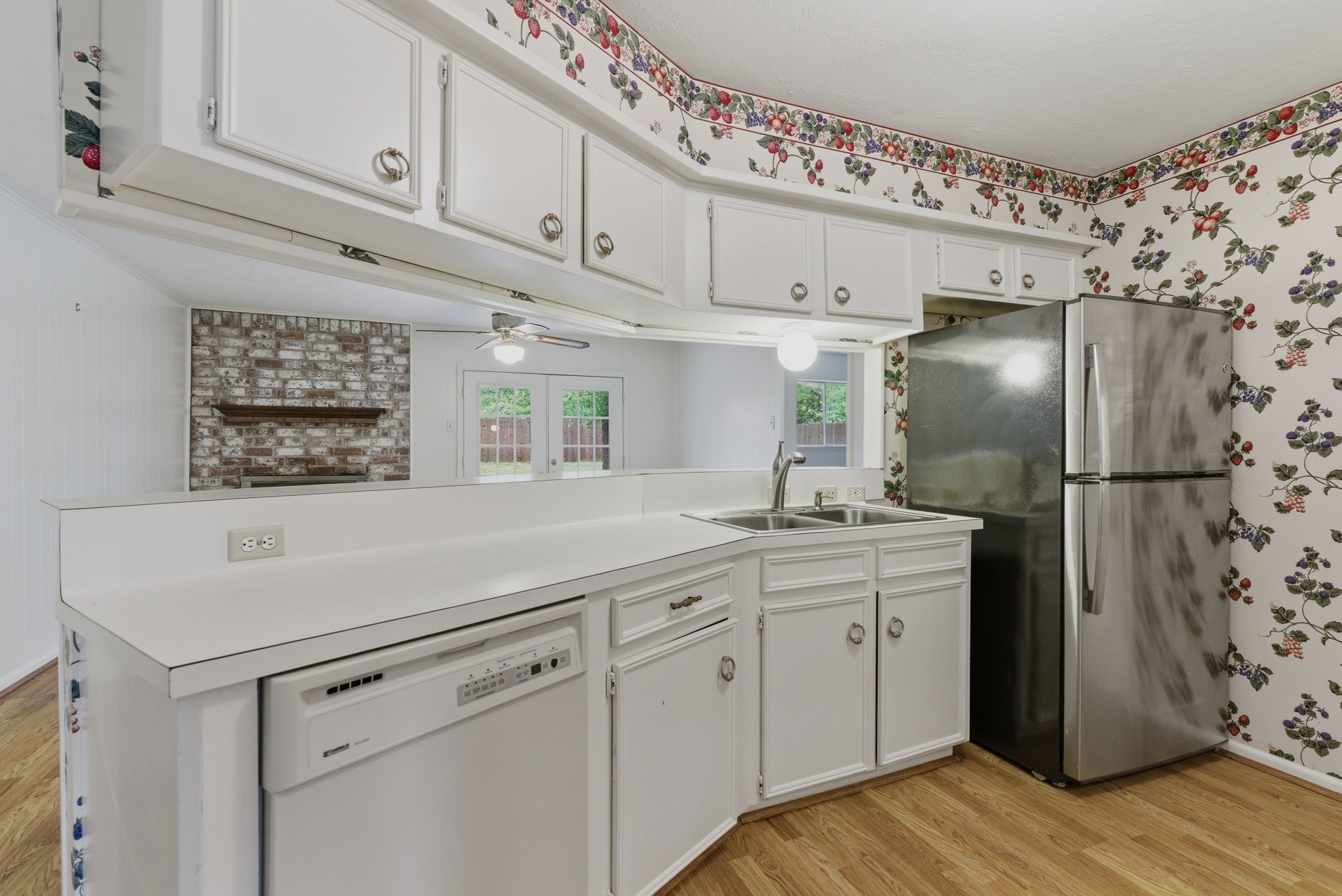 26503 Hillside Drive Spring, TX 77386 - Photo 11 of 22 a kitchen with stainless steel appliances a refrigerator sink and cabinets