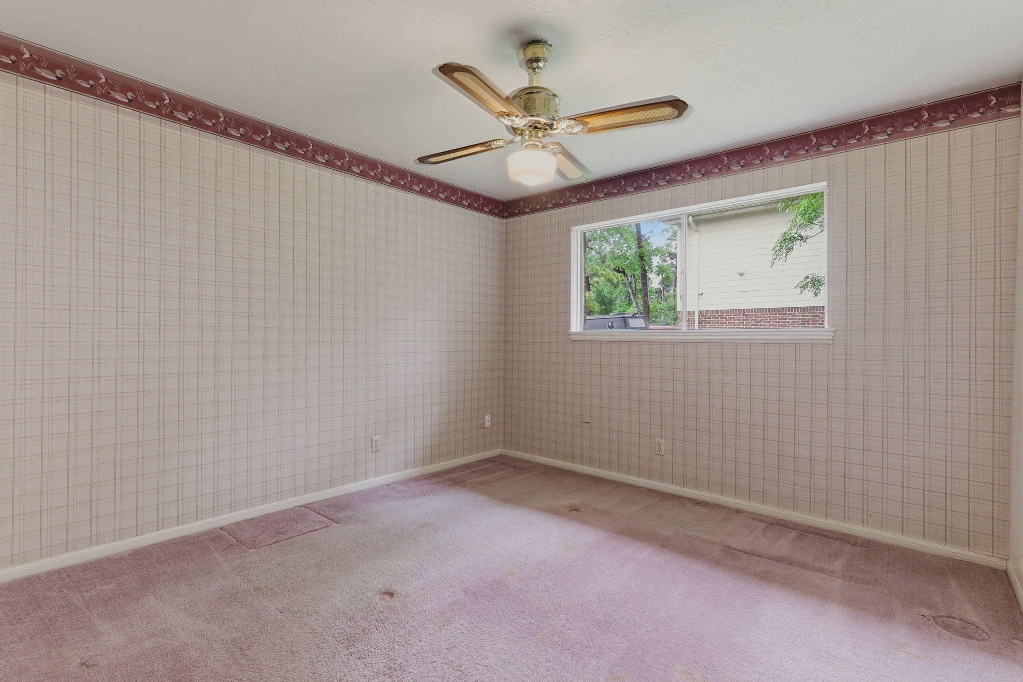 26503 Hillside Drive Spring, TX 77386 - Photo 17 of 22 a view of an empty room with a window