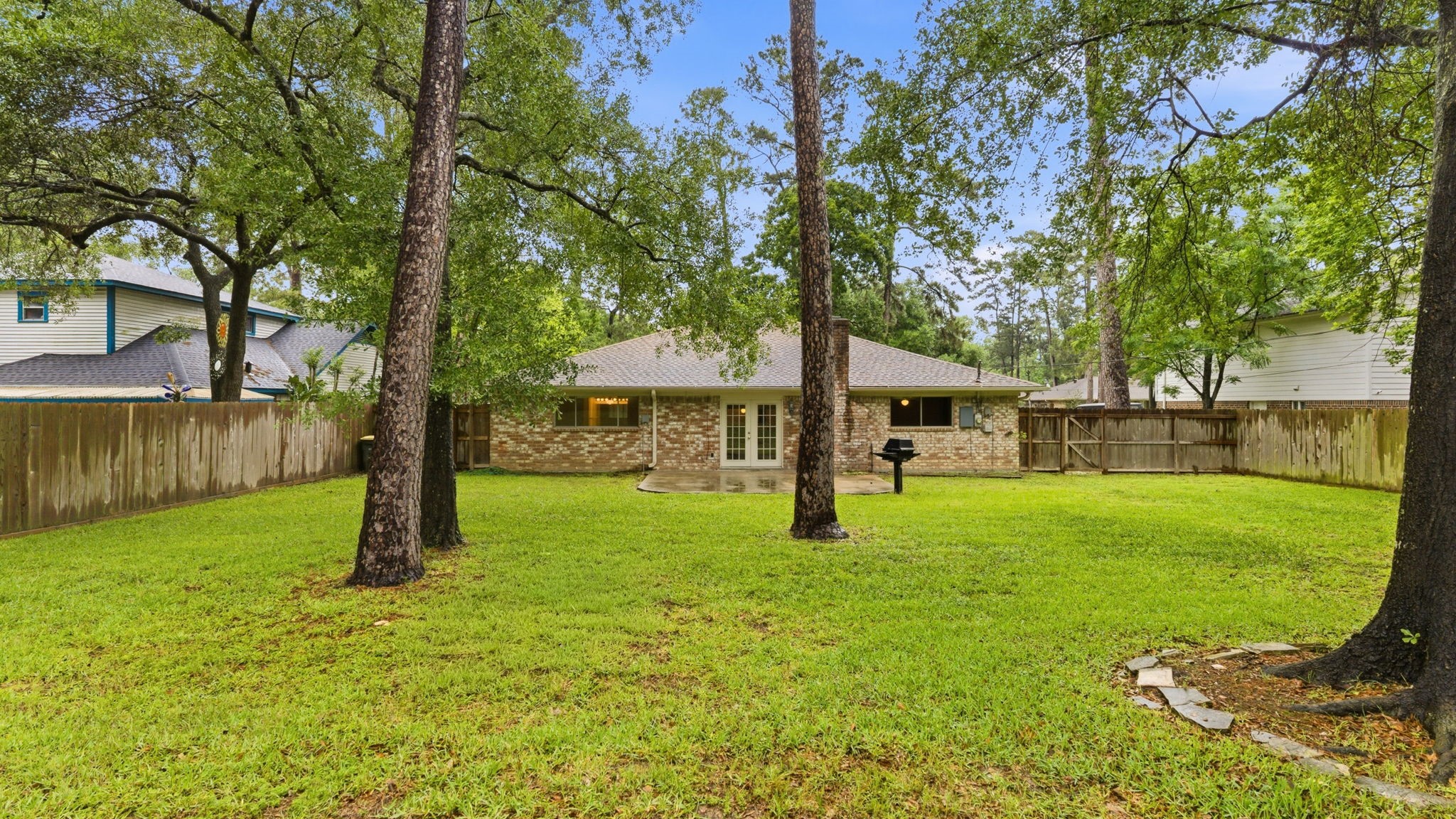 26503 Hillside Drive Spring, TX 77386 - Photo 20 of 22 a view of a house with backyard and a tree