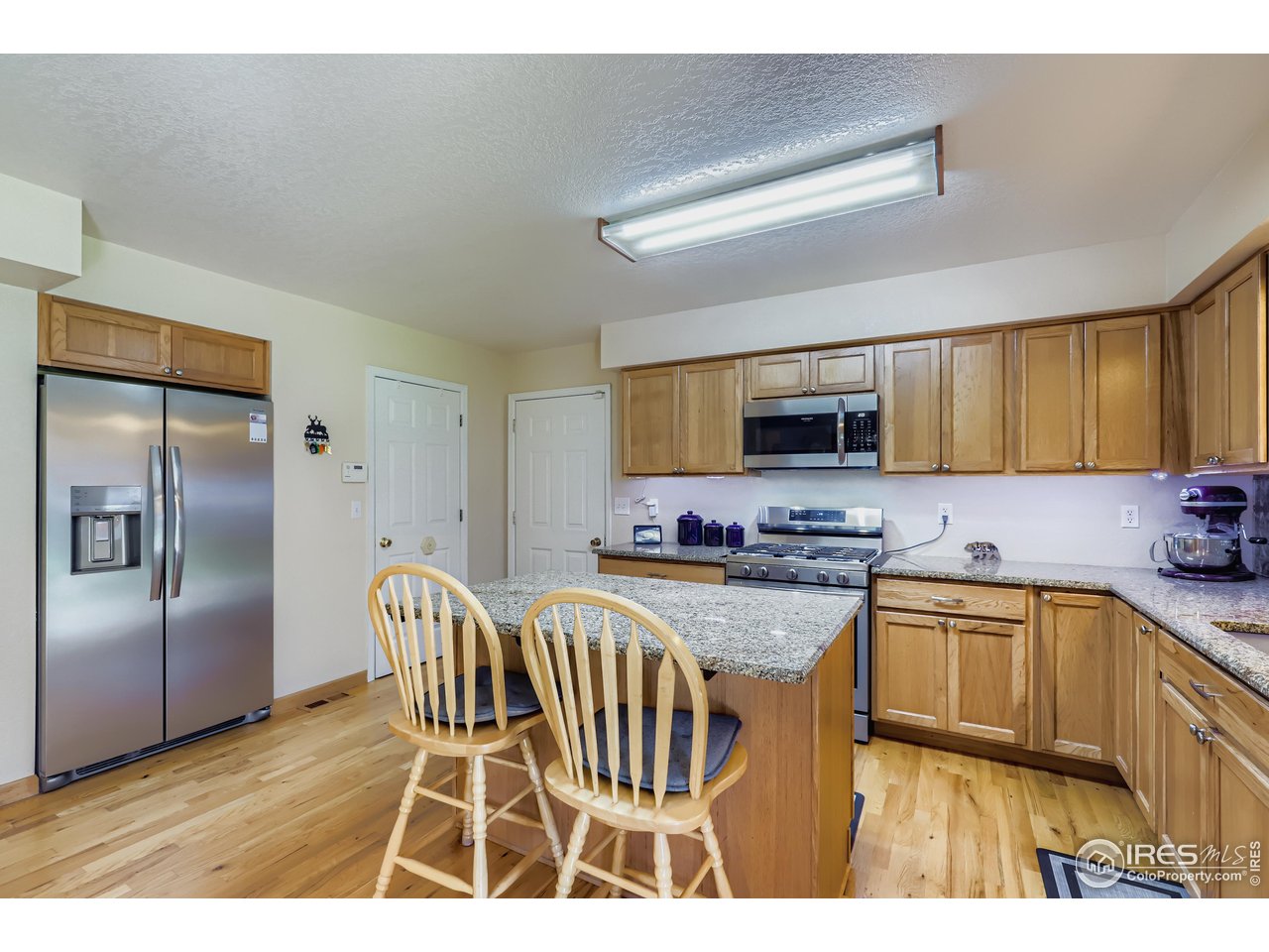121 Chestnut Street Windsor, CO 80550 - Photo 12 of 42 a kitchen with a sink appliances and cabinets