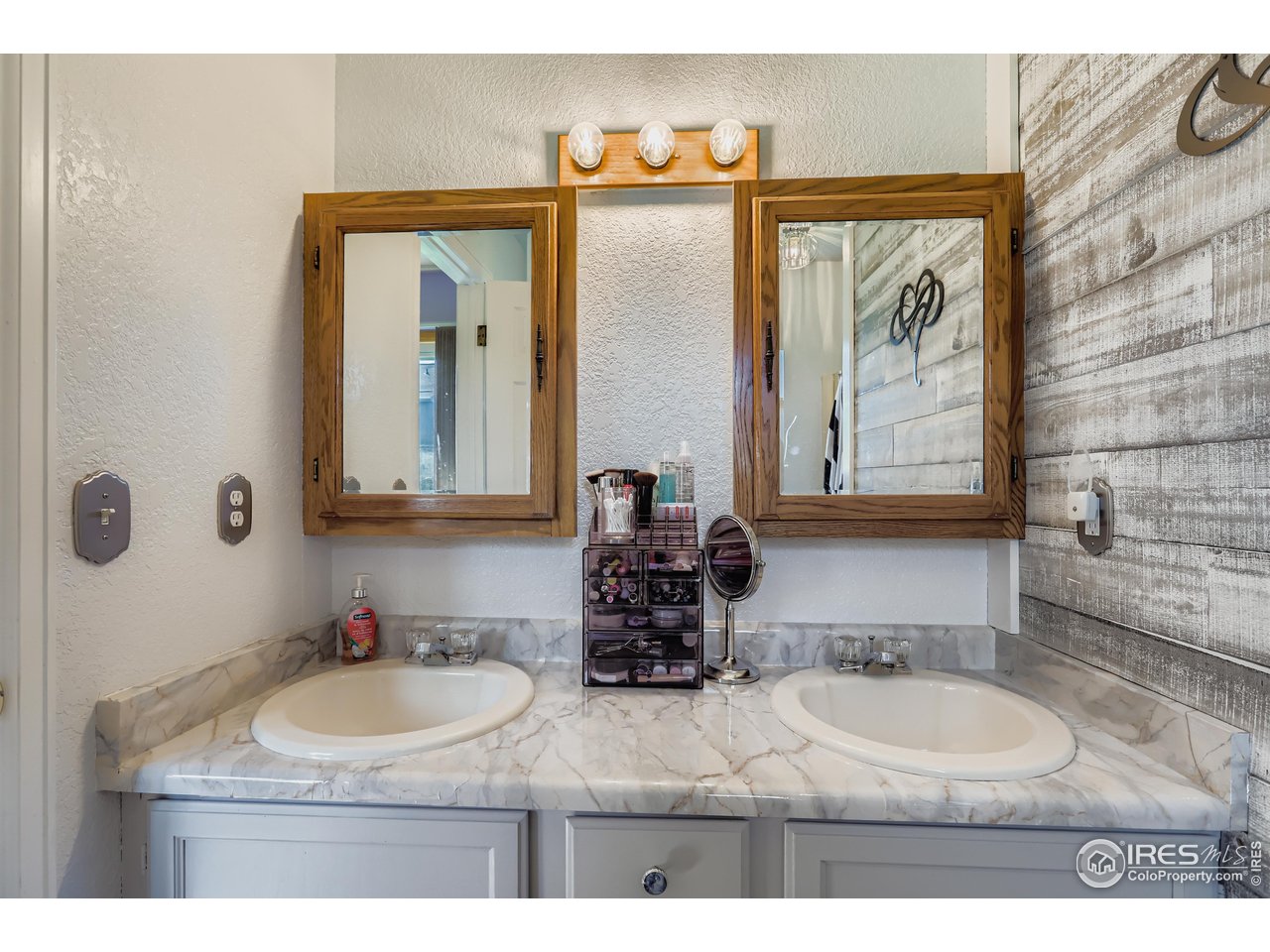 121 Chestnut Street Windsor, CO 80550 - Photo 16 of 42 a bathroom with a granite countertop sink and a mirror