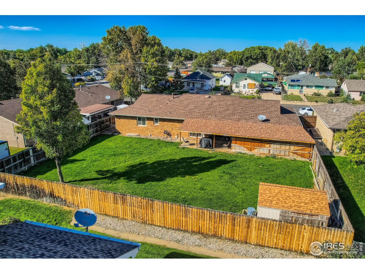 121 Chestnut Street Windsor, CO 80550 - Photo 29 of 42 a view of a house with a yard