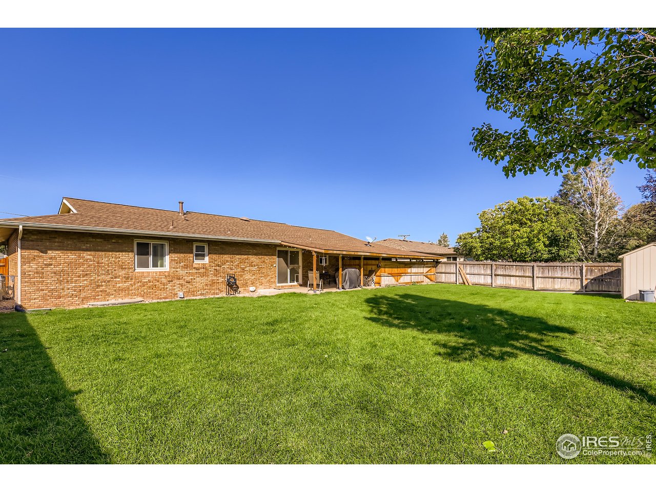 121 Chestnut Street Windsor, CO 80550 - Photo 30 of 42 a view of a house with a big yard