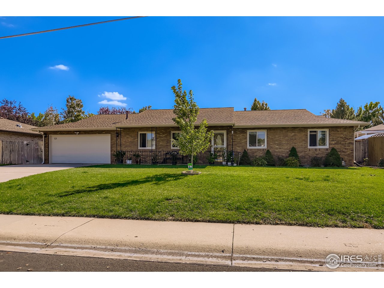 121 Chestnut Street Windsor, CO 80550 - Photo 4 of 42 a front view of a house with a yard