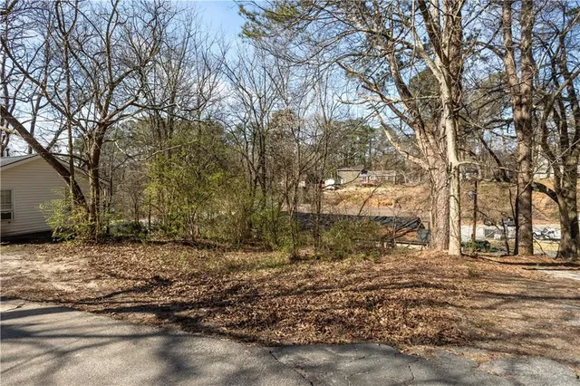 a view of a yard with snow on the road