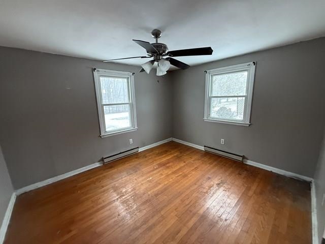 239 Harriston Road Grottoes, VA 24441 - Photo 13 of 20 a view of empty room with wooden floor and fan