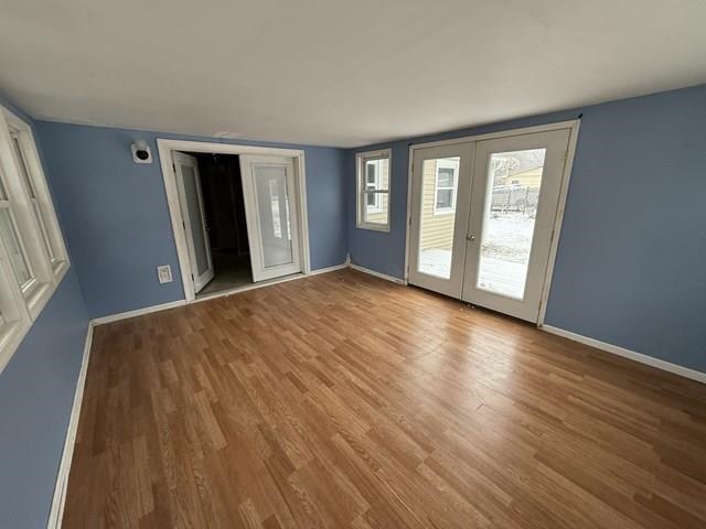 239 Harriston Road Grottoes, VA 24441 - Photo 17 of 20 a view of an empty room with wooden floor and a window