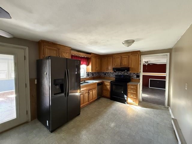 239 Harriston Road Grottoes, VA 24441 - Photo 9 of 20 a kitchen with granite countertop a refrigerator and cabinets