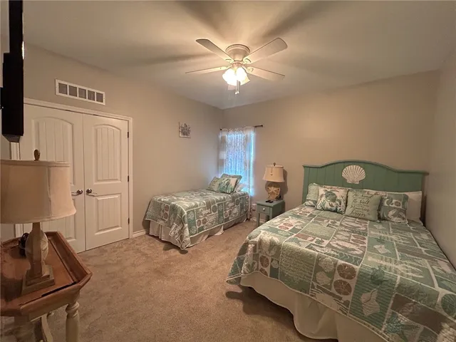 a bedroom with double bed and a window