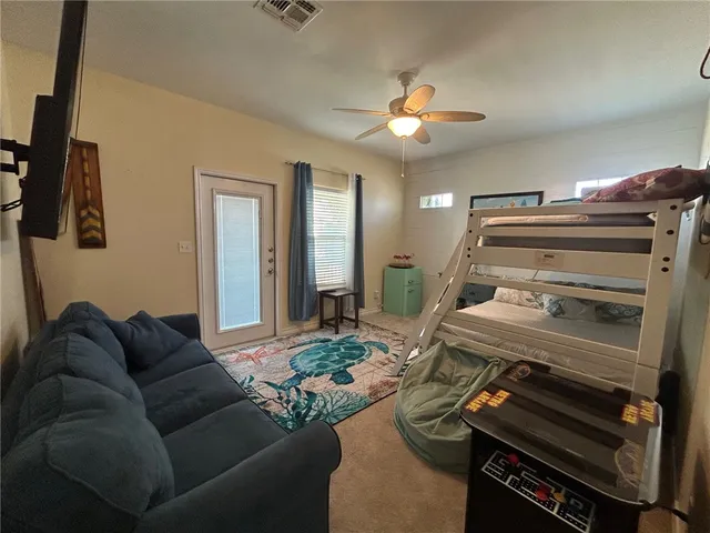 a view of a livingroom with furniture and a flat screen tv