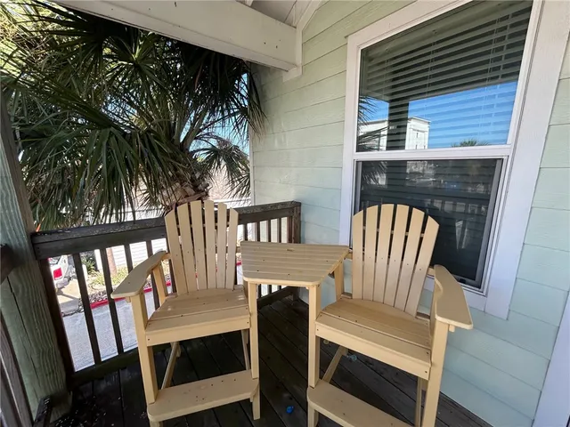 a view of a two chairs in the porch