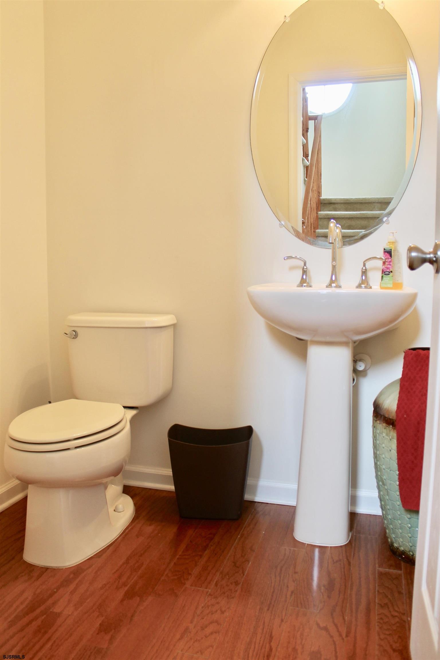 130 Dunlin Lane, Unit 16 Pleasantville, NJ 08232 - Photo 13 of 47 a bathroom with a toilet and a mirror