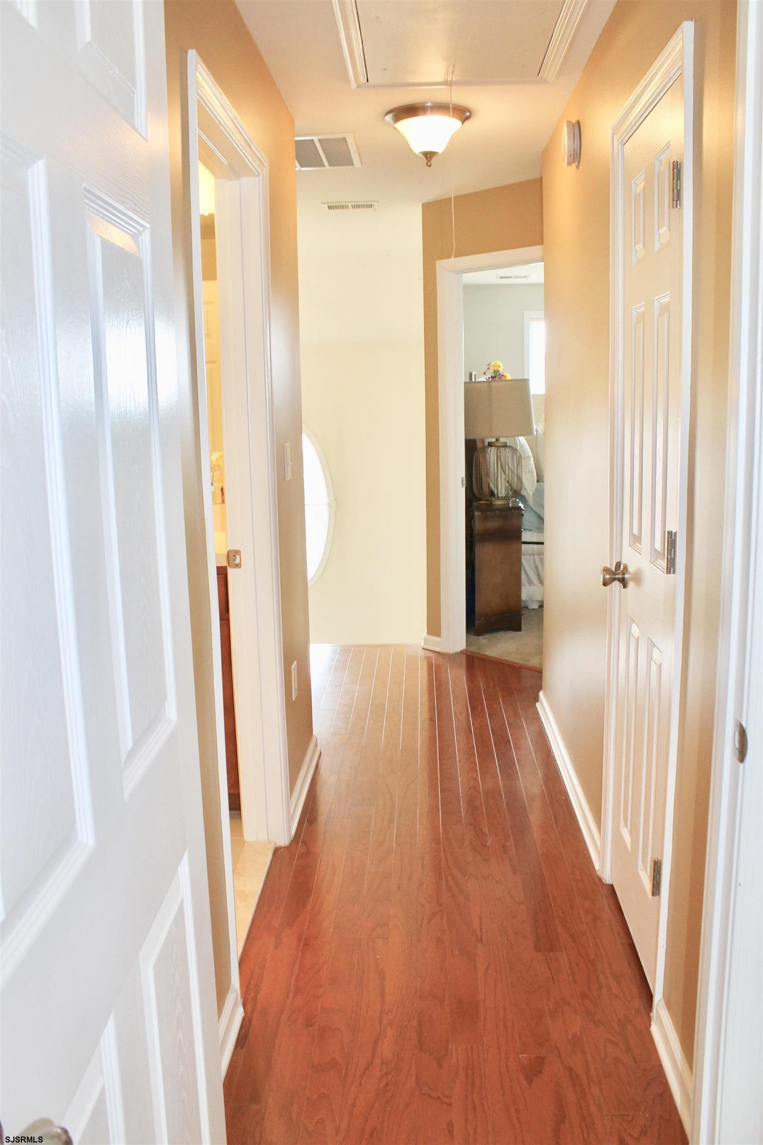 130 Dunlin Lane, Unit 16 Pleasantville, NJ 08232 - Photo 14 of 47 a view of a hallway with wooden floor and staircase